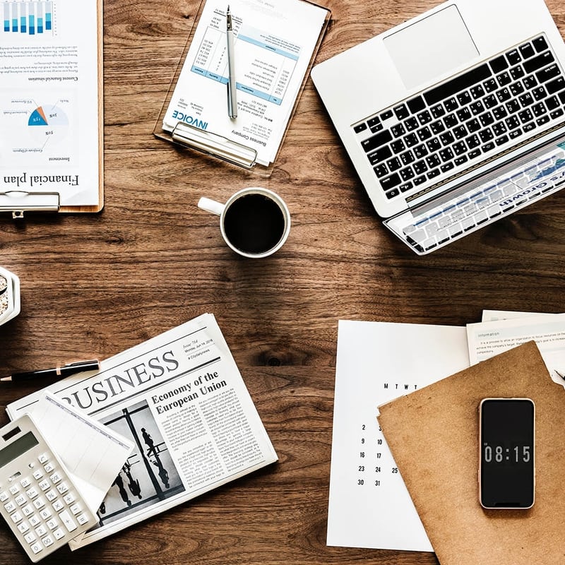 Professional workspace with coffee and documents