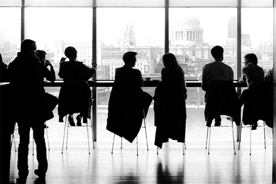 Novus Analytics team collaborating in the office